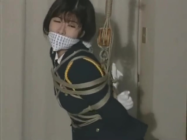 Japanese Policewoman helplessly bound
