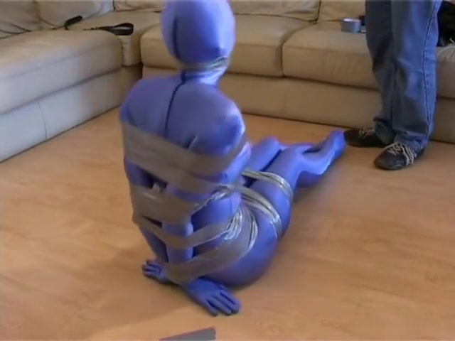 tape bound and gagged in blue zentai
