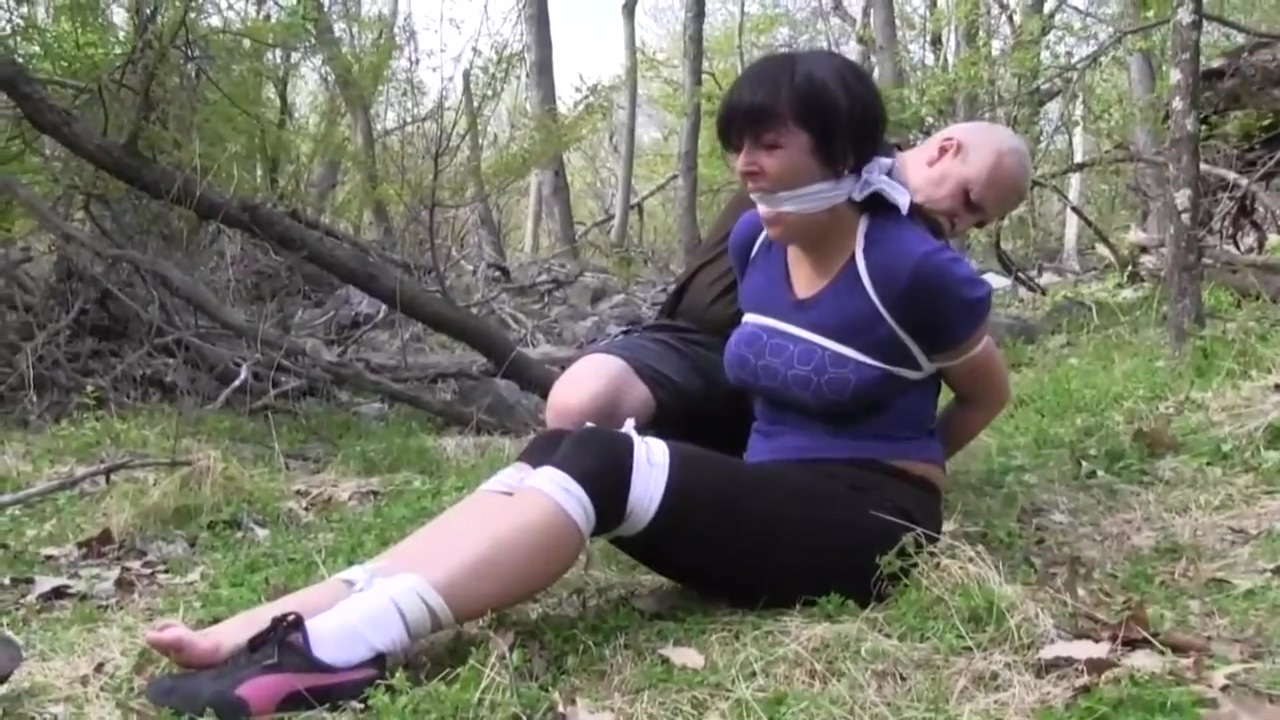 Dixie gets bound and gagged in the forest
